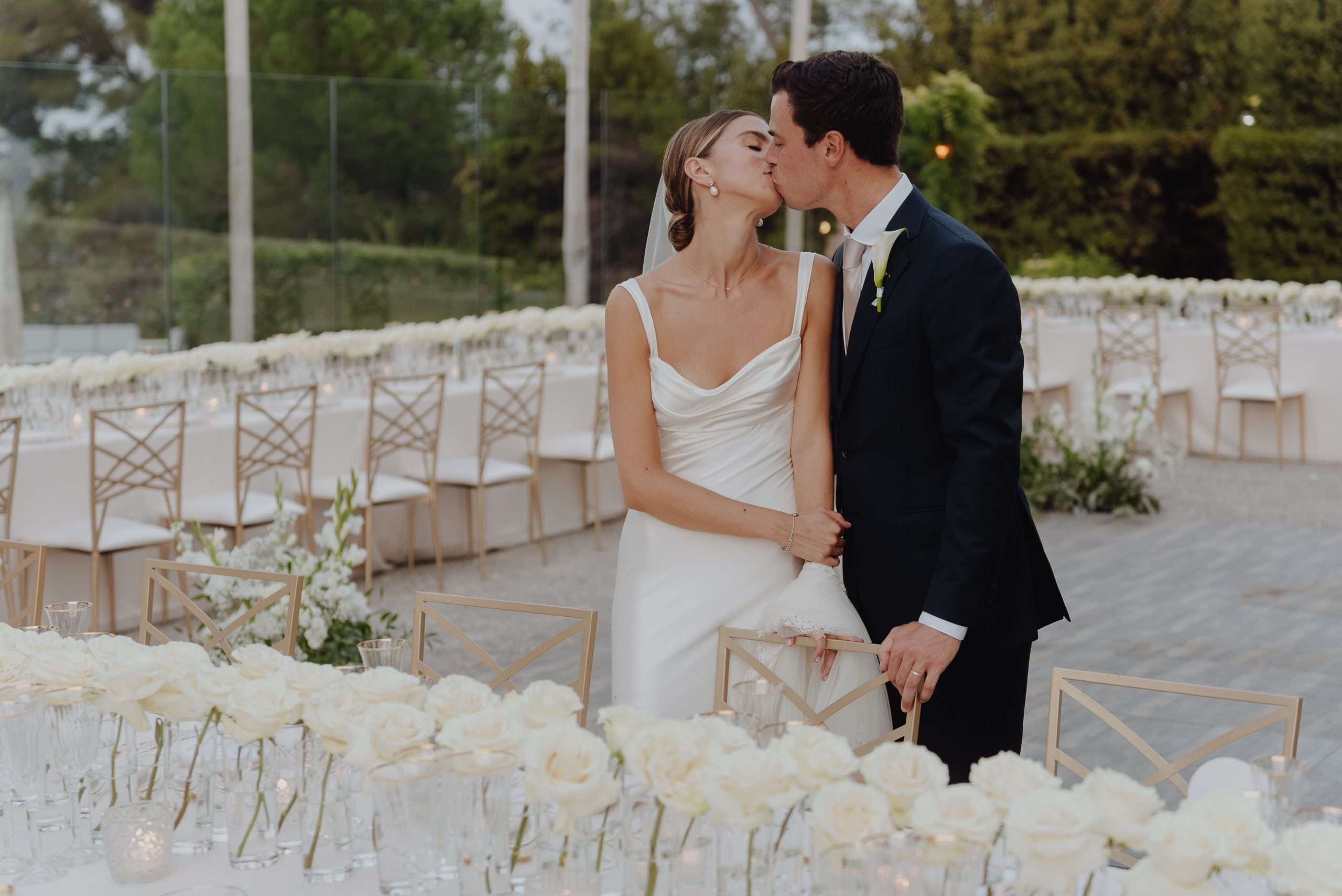 Bride and groom kissing at French Riviera wedding reception