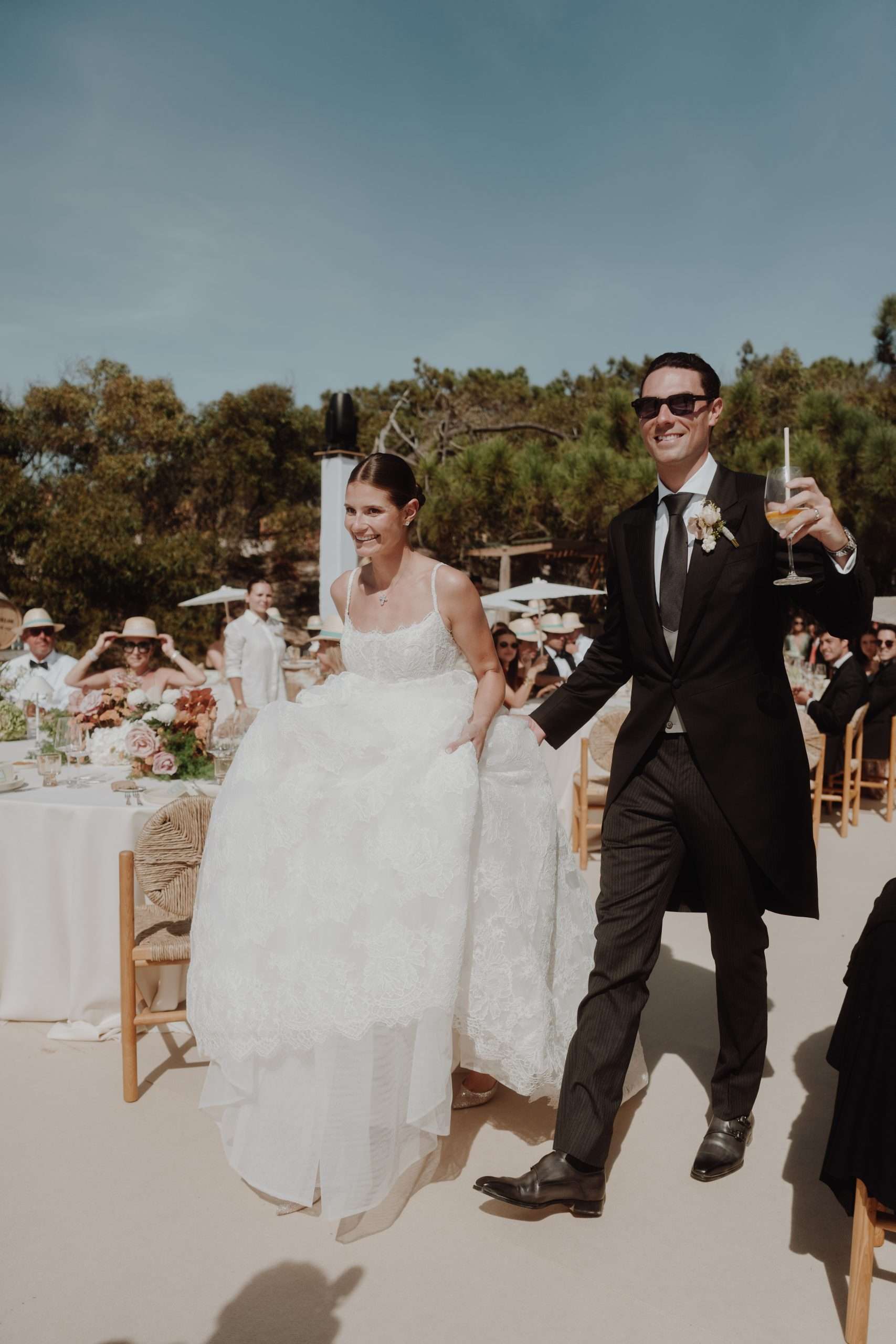 Bride and groom walking into wedding dinner at CostaTerra Comporta Portugal