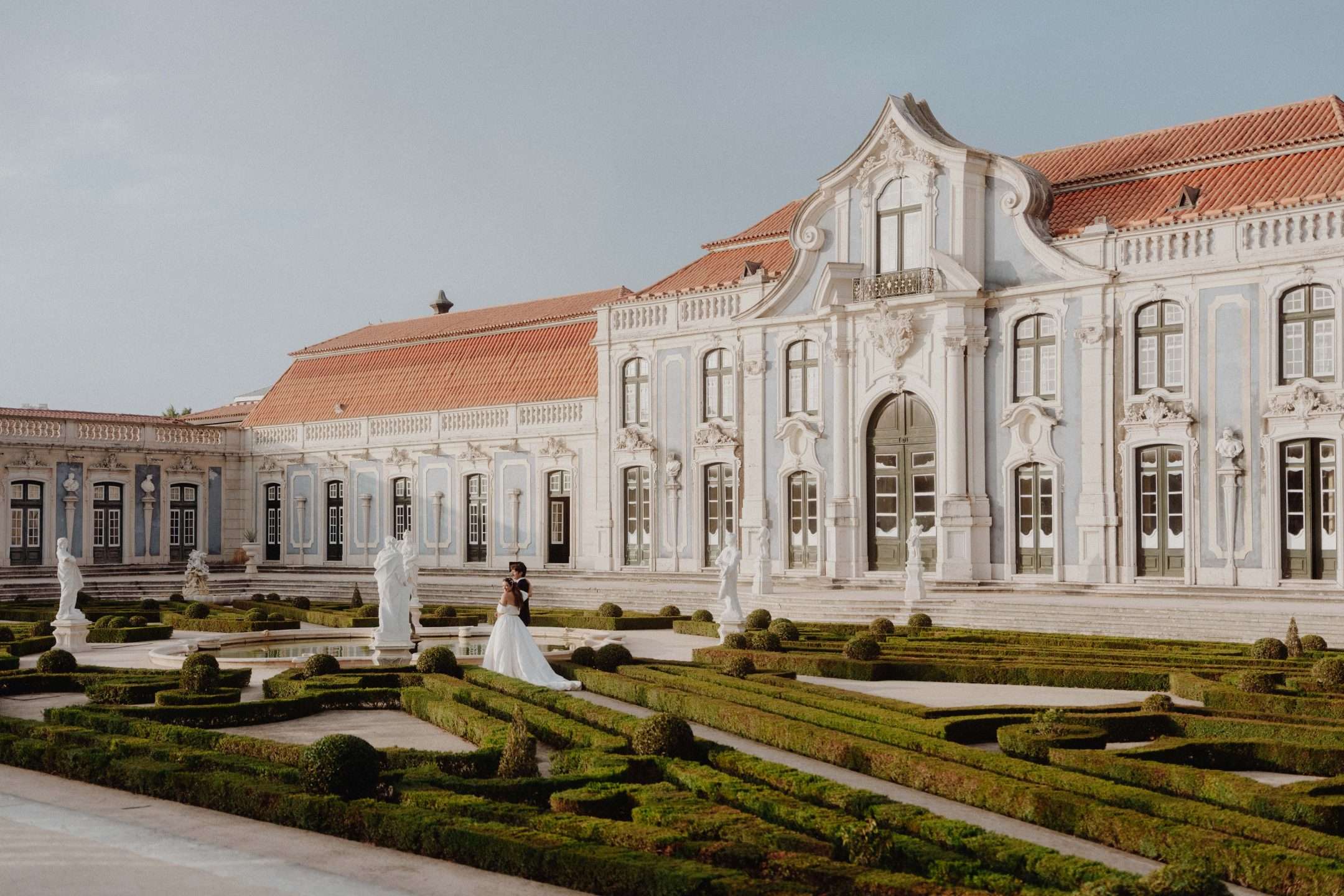 Bride and groom at Queluz Palace gardens Portugal